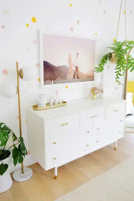 dresser with family photo above it