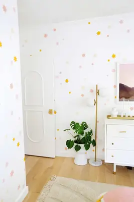 plant, standing globe lamp, and dresser