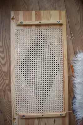 Cut the cane panel to fit the cabinet door