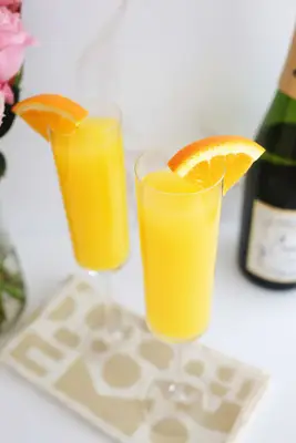 mimosa with orange wedge