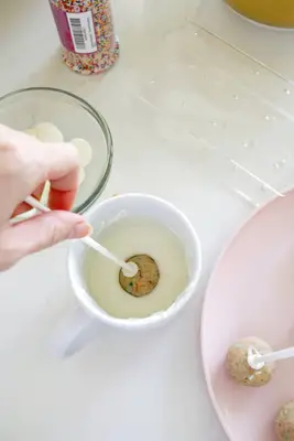 dipping cake pops in chocolate