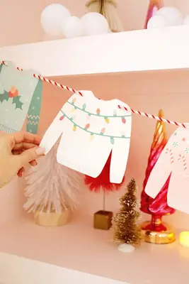 white paper christmas sweater on garland