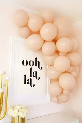 pink balloon garland over table