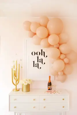 pink balloon garland over table