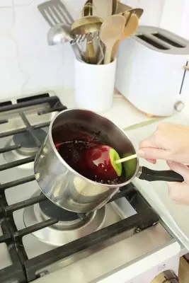 dipping apples in candy coating