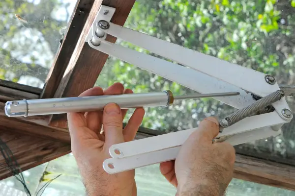 Fitting an automatic greenhouse vent opener