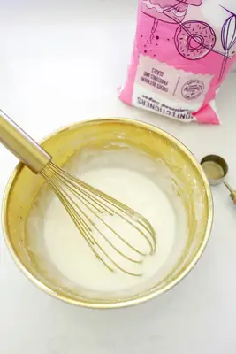 making icing for melted snowman cookies