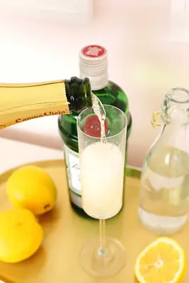 making a french 75 cocktail