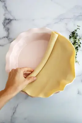 rolling out crust for chicken pot pie