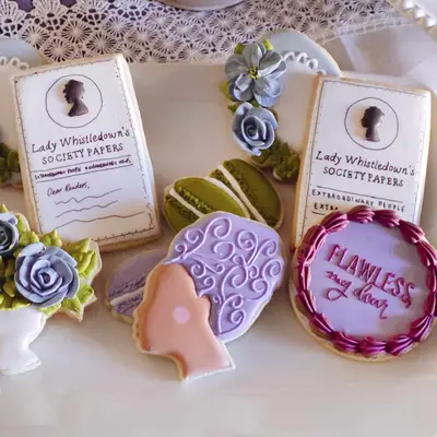 An assortment of Bridgerton-inspired royal icing cookies