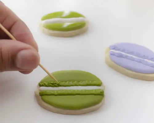 using toothpick to make macaron cookies