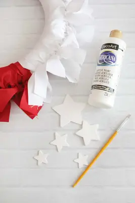 painting stars white for ribbon wreath