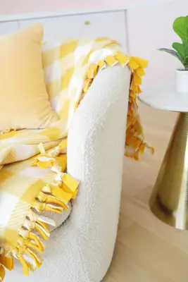 no sew tied fleece blanket draped over chair