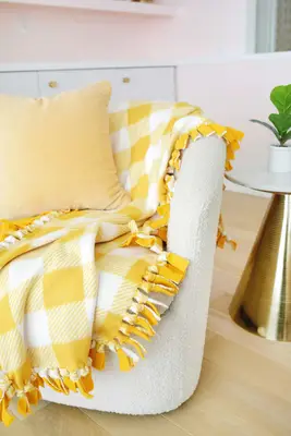 fleece no sew blanket draped over a chair