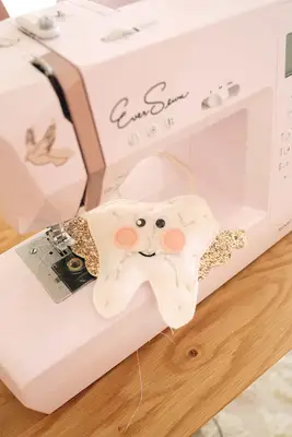 Tooth pillow being sewn around the edge