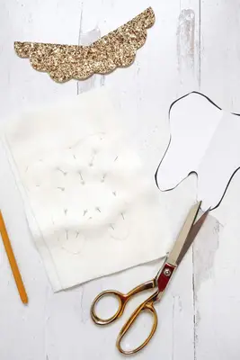 Tooth pillow pattern traced onto white felt ready to be cut out