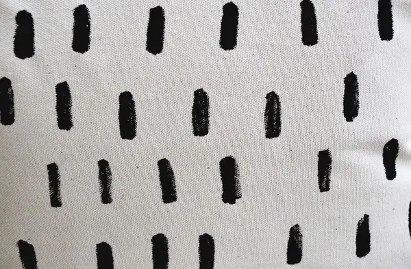 pillow with black painted stripes. 