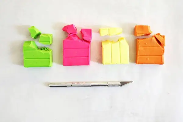 different colored clay and an X-acto knife