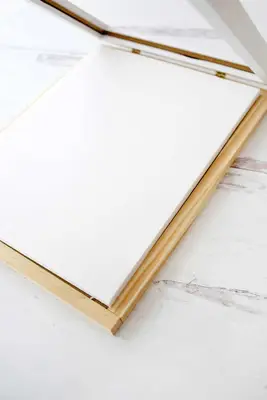 Foam core board glued onto back of photo frame display