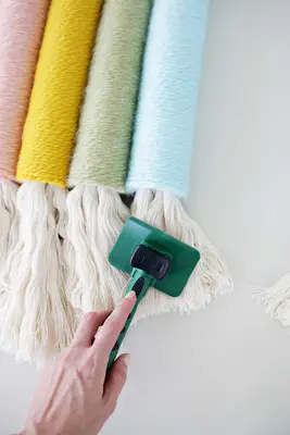 someone pet brushing the ends of the heavy rope