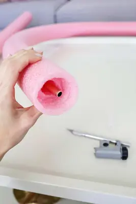 cooper tubing inside a pink pool noodle