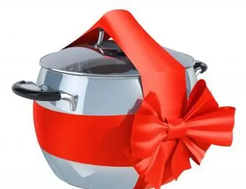 Cozinhar inoxidável com fita vermelha e arco