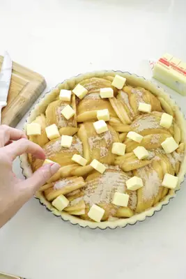 adding filling to apple tart