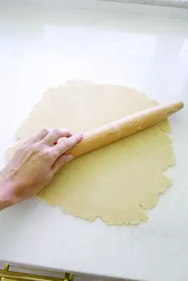 Rolling out dough for easy apple tart