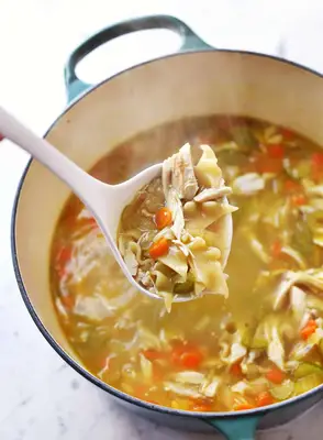 ladle of rotisserie chicken noodle soup