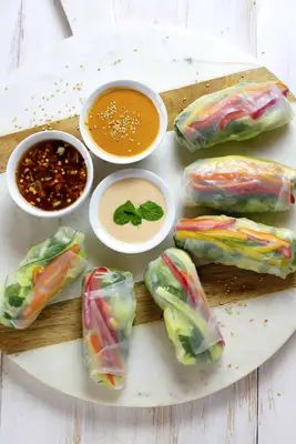 roll up your prepped veggies in the spring roll wrappers with different sauces