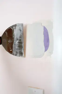 someone mudding over the hole with the mudding tool