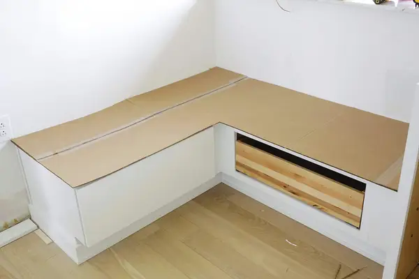 banquette with cardboard template of seat on top