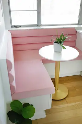 Pink banquette in kitchen corner