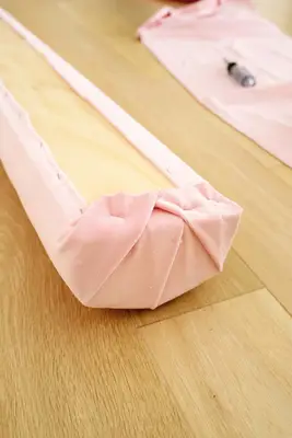 fabric wrapped around end of bolster