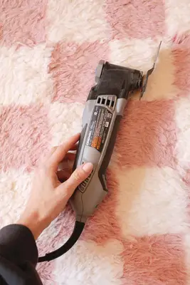 hand holding a dremel tool