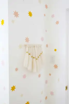 star wallpaper with a woven wall hanging