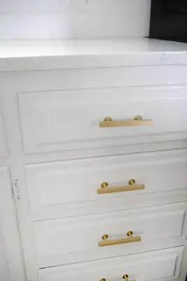 white drawers with gold handles