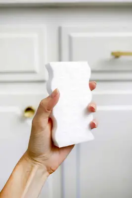 someone holding a dry eraser