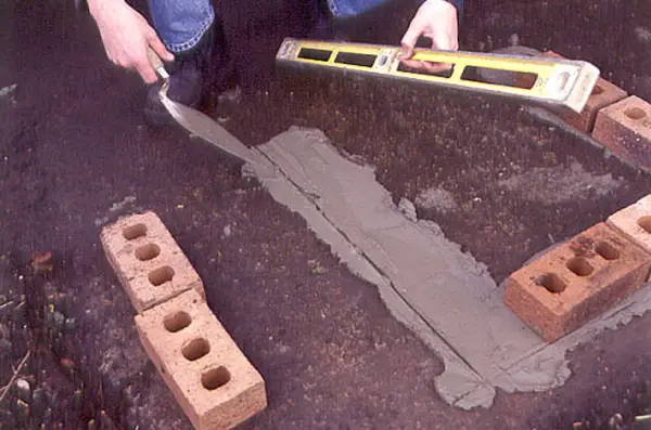 Marking out the edge of the barbecue