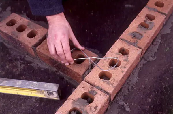 Inserting a metal tie