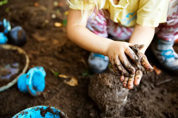Having fun with mud. Getty Images