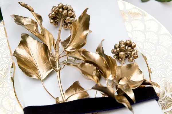 Attaching the ivy sprigs to napkins