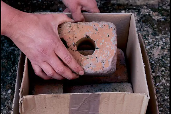 Weighing down the second box with a brick