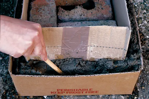 Adding cement to make the sides