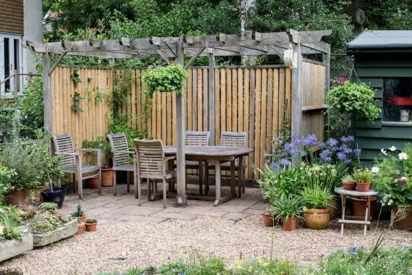 Wooden pergola with back fence for extra shelter