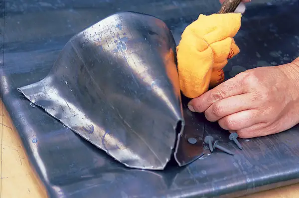 Making a lead planter - hammering the lead to the walls