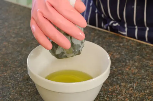 How to make comfrey ointment - straining the mixture