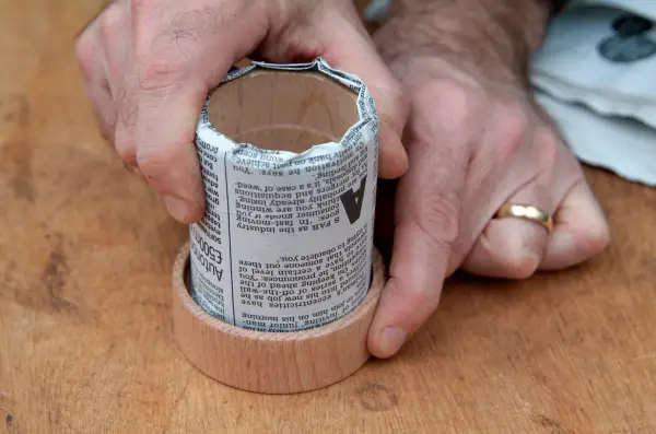 Pushing the pot firmly into the base of the mould