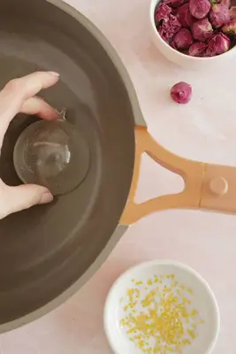 melting edges of half sphere on warm pan