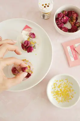 tea bombs being filled with tea and flowers